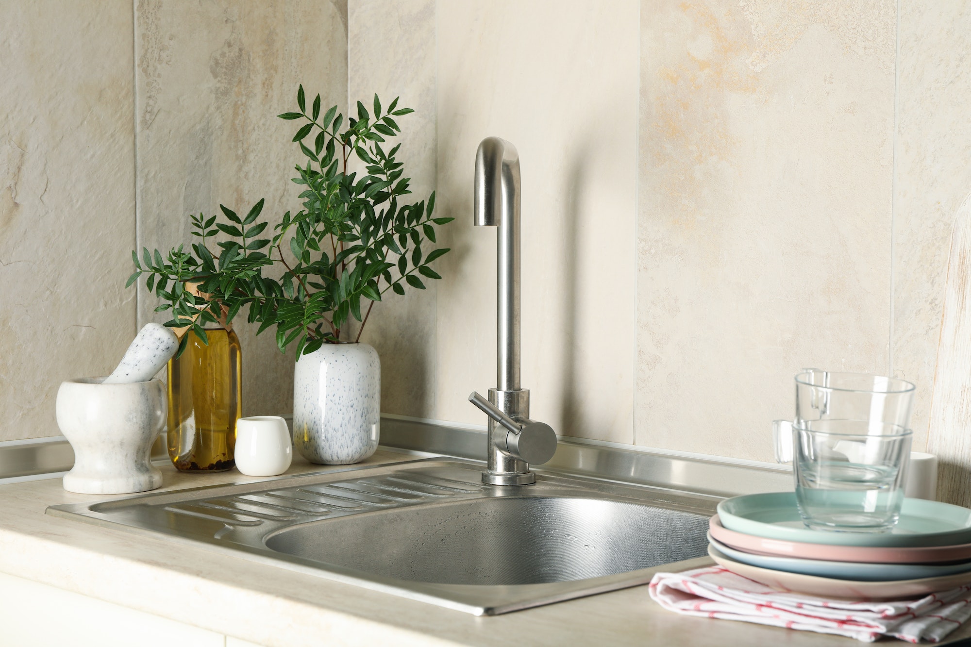 Kitchen interior with sink and different supplies