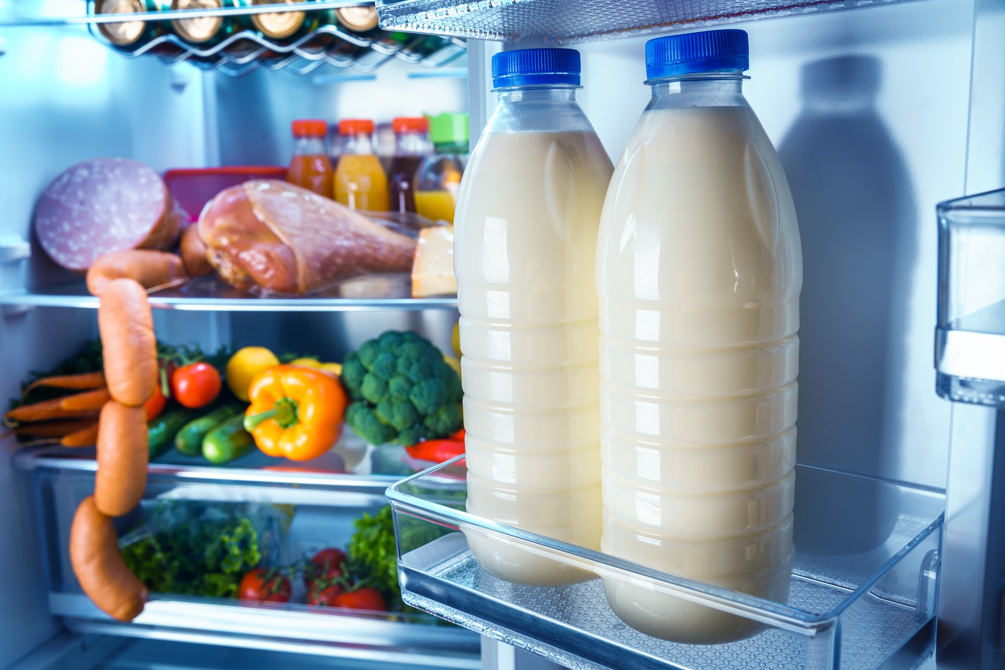 Open refrigerator filled with food